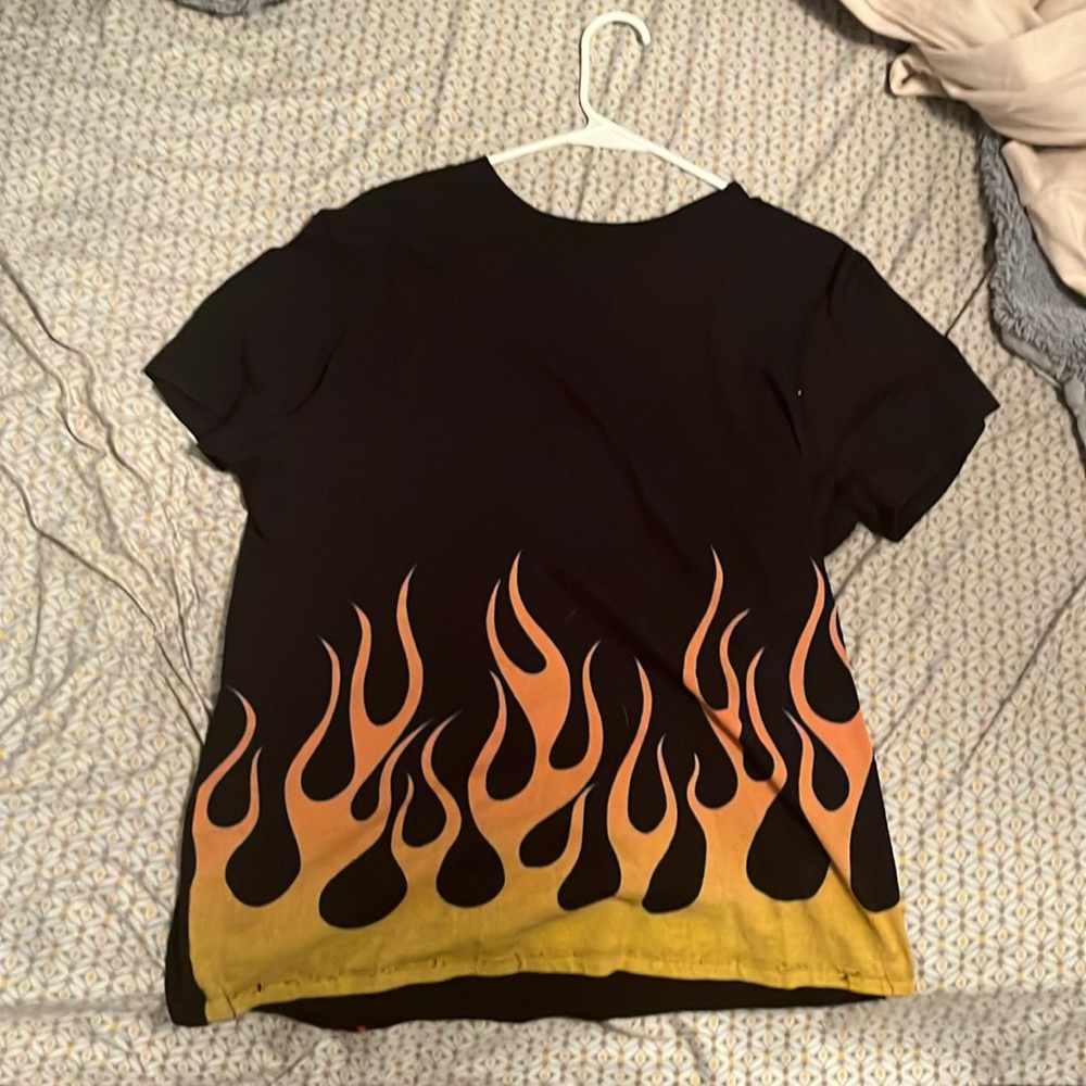 Emo fire shirt from rue 21 it’s straight hem and it’s a large
